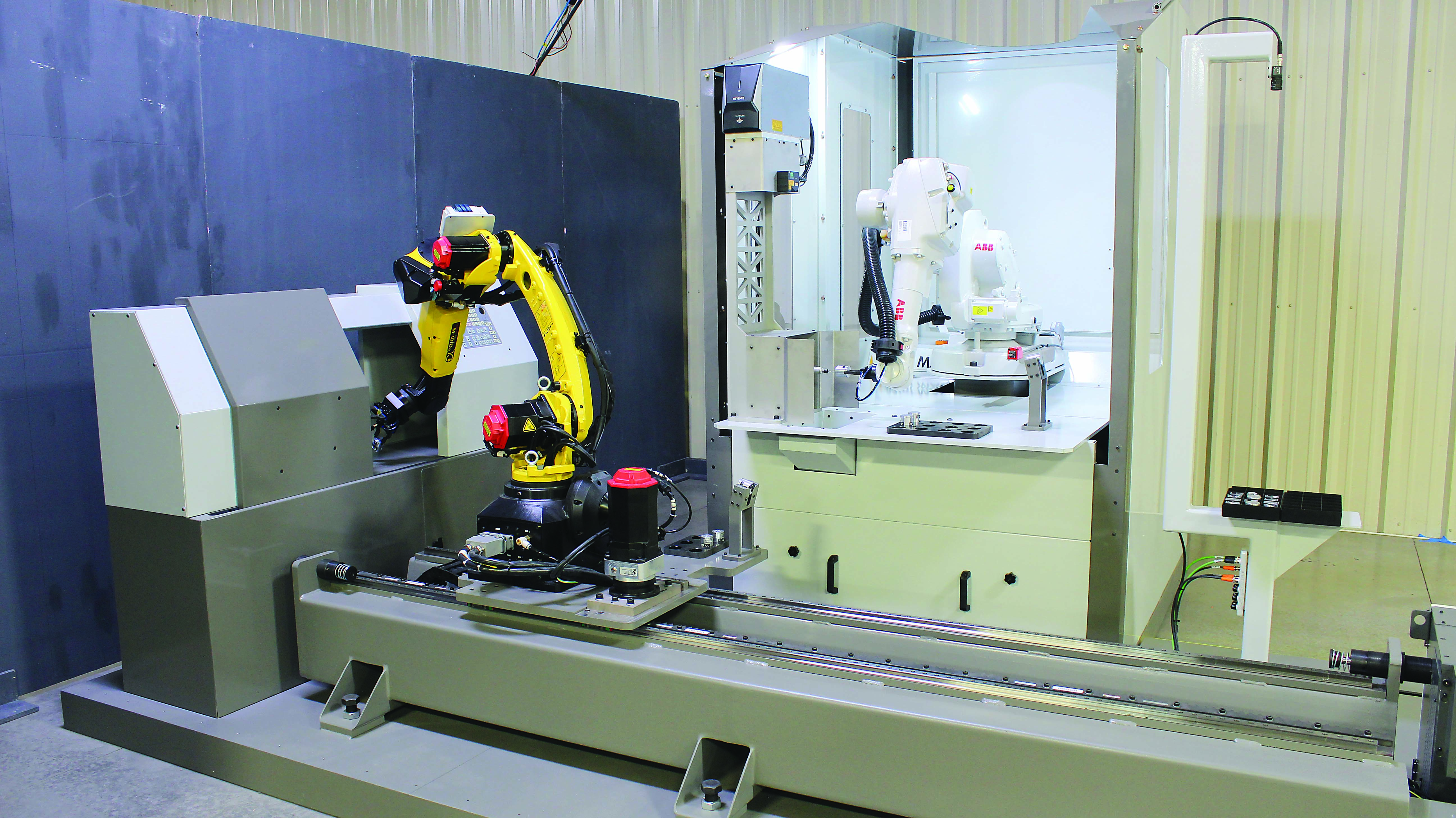 This cell includes a CNC machine, two robot arms, an ATI Industrial Automation deburring tool and a gripper tool.