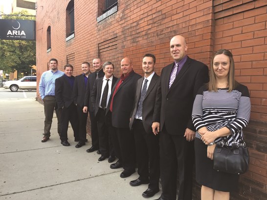 MITGI's leadership team, from left to right: Jesse Korson, John Korson, Nate Bode, Ryan Zimmerman, Bruce Kasal, Jeff Streich, Ted Doring, Eric Lipke, Andrea Waller-Plath. Not pictured: Sheila Murphy, Jennie Nelson.