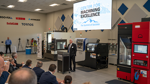 Bill Obras of REGO-FIX welcomes partners and guests to grand opening of the company's Center for Machining Excellence.