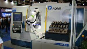 A Romi machine outfitted with a collaborative robot for automated loading and unloading.