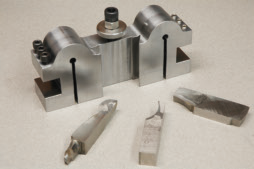 Multipurpose tool bits, such as this one that turns ODs, chamfers IDs and ODs and faces part surfaces, can save time when manually changing tools. Image courtesy of Tom Lipton.