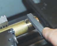 A thread file is ideal for straightening the annoying half thread fade at the beginning and end of an external thread. Image courtesy of Tom Lipton.