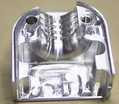 Mil-Tec produced this progressive form tool to enable Toolcraft to replace two ballnose endmills and significantly reduce the cycle time when machining a 6061 aluminum part (below). Images courtesy Mil-Tec. Mil-Tec produced this progressive form tool to enable Toolcraft to replace two ballnose endmills and significantly reduce the cycle time when machining a 6061 aluminum part (below). Images courtesy Mil-Tec.