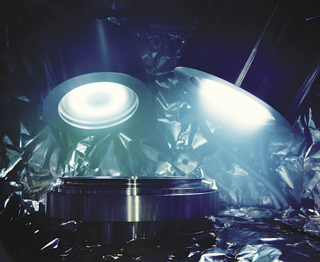 A sputtering cathode lights up under high voltage. Image courtesy Angstrom Sciences. A sputtering cathode lights up under high voltage. Image courtesy Angstrom Sciences.