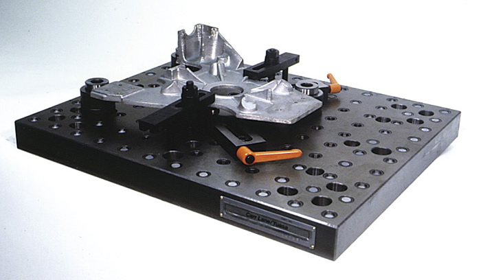 Irregularly shaped parts, such as this casting, can be clamped directly to a modular baseplate. Image courtesy Carr Lane Manufacturing. Irregularly shaped parts, such as this casting, can be clamped directly to a modular baseplate. Image courtesy Carr Lane Manufacturing.
