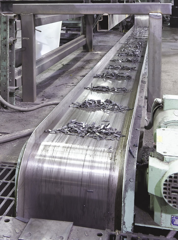 An Eriez magnetic conveyor moves punch-press scrap. Image courtesy of Eriez. An Eriez magnetic conveyor moves punch-press scrap. Image courtesy of Eriez.