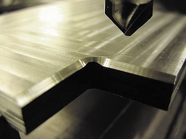 Shown is an inconsistent chamfer on an inside radius. This was because the Z height of the chamfering tool wasn't set correctly. All images courtesy J. Harvey. Shown is an inconsistent chamfer on an inside radius. This was because the Z height of the chamfering tool wasn't set correctly. All images courtesy J. Harvey.