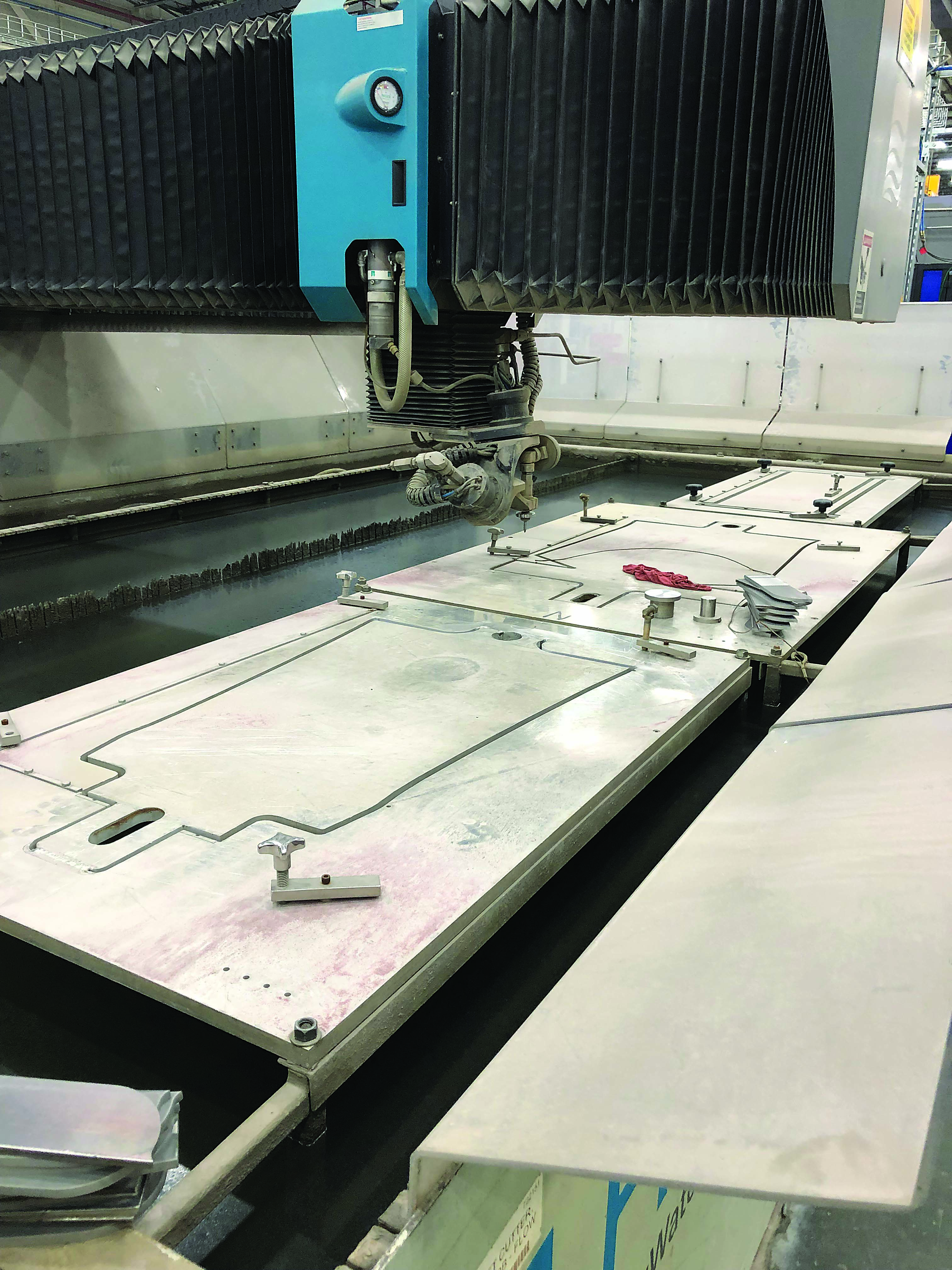 Cutting raw materials into usable workpieces