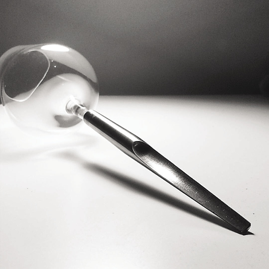 The Pointer glass sticks into the ground to avoid spilling its contents. Image courtesy Ramona Enache. The Pointer glass sticks into the ground to avoid spilling its contents. Image courtesy Ramona Enache.