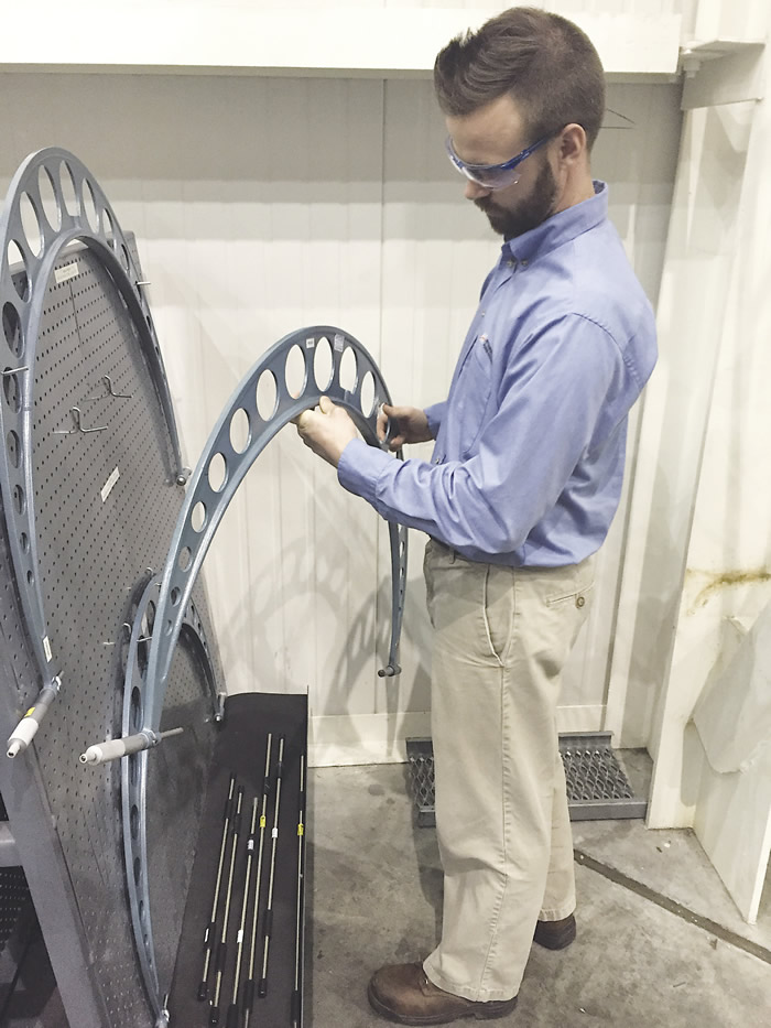 Joel Johnson, a quality engineer at Mitsubishi Hitachi Power Systems, checks calibration stickers on large micrometers used to measure the journals of gas turbine rotors. All images courtesy C. Tate. Joel Johnson, a quality engineer at Mitsubishi Hitachi Power Systems, checks calibration stickers on large micrometers used to measure the journals of gas turbine rotors. All images courtesy C. Tate.