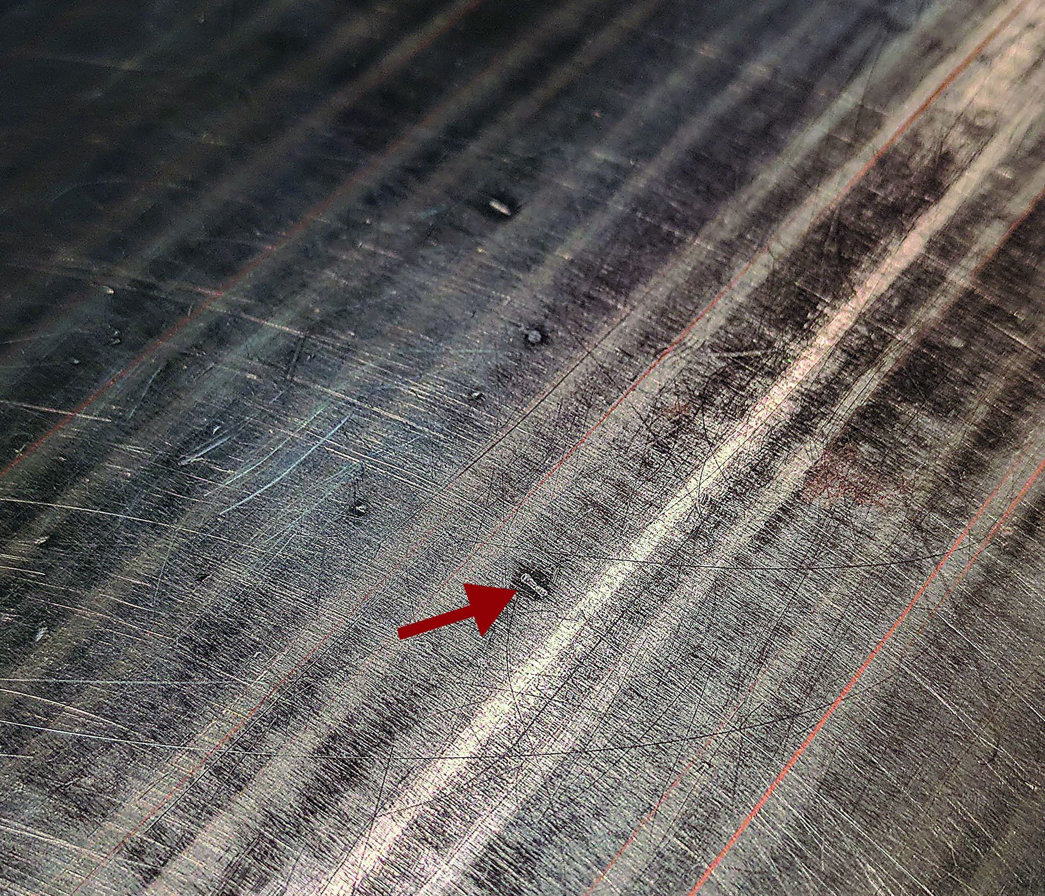 Figure 3. If a workpiece projection is correctly removed, a low spot surrounded by a polished ring in the shape of a ding appears. Image courtesy of Tom Lipton.