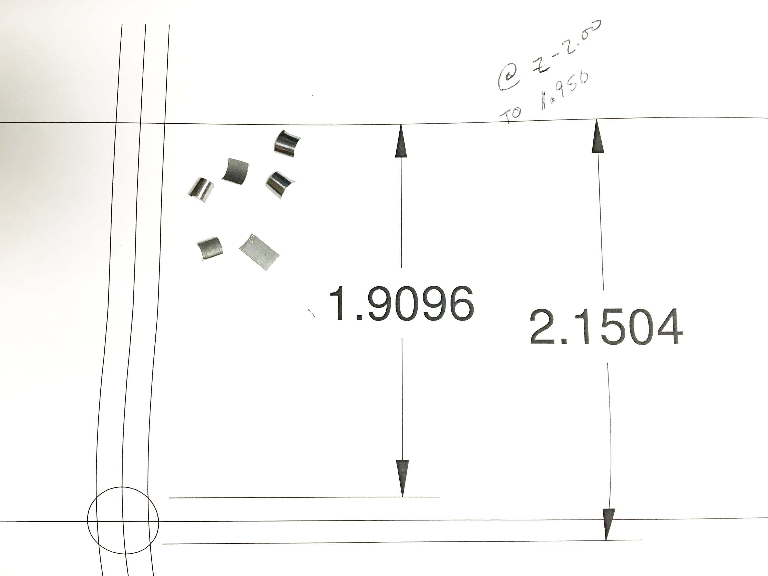 The dimensions (in inches) for when a chip breaks out of a cross-hole and when it starts to touch the other side of the hole, along with a selection of chips produced when broaching blind keyways. Image courtesy of Muthig Industries.