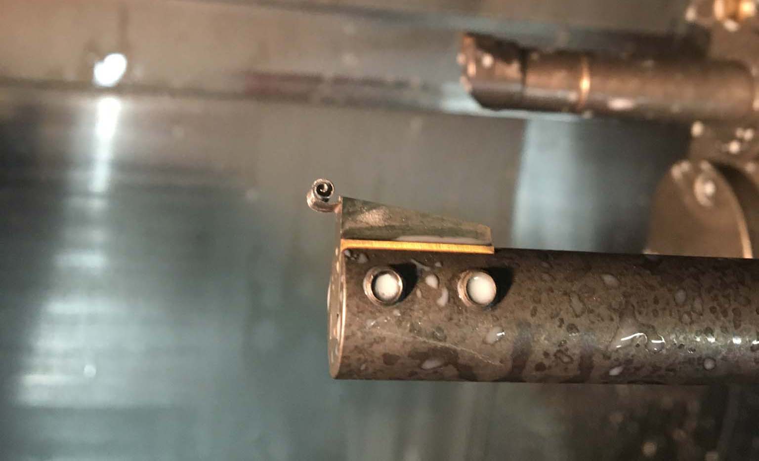 A chip became welded to an insert during blind-keyway broaching at Muthig Industries. Image courtesy of Muthig Industries.
