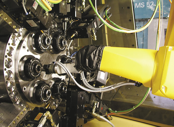 Robotic part handling increases spindle capacity and reduces floor space requirements. Robotic part handling increases spindle capacity and reduces floor space requirements.