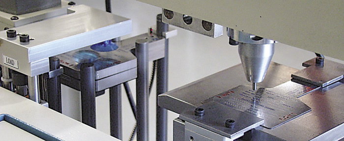 Dot-peening machines, such as the Tag Master 3 from Kwik Mark, feature a vibrating punch that produces a series of evenly spaced, small-diameter indentations in the surface of a part. Dot-peening machines, such as the Tag Master 3 from Kwik Mark, feature a vibrating punch that produces a series of evenly spaced, small-diameter indentations in the surface of a part.
