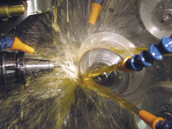 The inside of a CNC tool grinder is a busy place. Here, a small-diameter endmill is ground to size. Image courtesy Midwest Industrial Tool Grinding. The inside of a CNC tool grinder is a busy place. Here, a small-diameter endmill is ground to size. Image courtesy Midwest Industrial Tool Grinding.