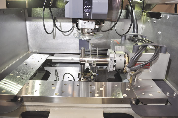 Mitsubishi's AT intelligent automatic threader reduces wire curl and rethreads through the gap if the wire breaks. Image courtesy MC Machinery Systems. Mitsubishi's AT intelligent automatic threader reduces wire curl and rethreads through the gap if the wire breaks. Image courtesy MC Machinery Systems.