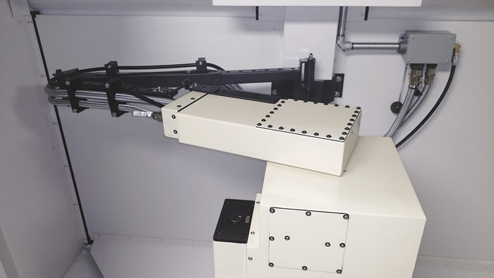 Cable management is accomplished with a scissor arm above the pallet that rotates or bends along with the movement of the B-axis on the HMC. Cable management is accomplished with a scissor arm above the pallet that rotates or bends along with the movement of the B-axis on the HMC.