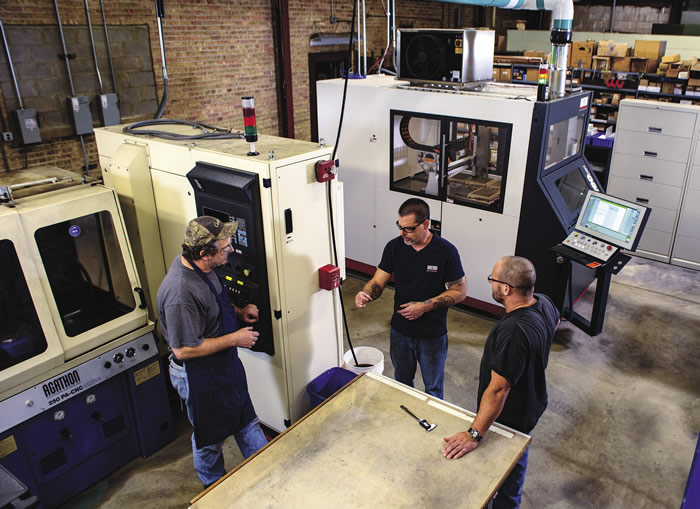 Left to right: Mark Wawiorka, operator and technician; Chuck Best, CNC operator and technician; and Dan Quinn, operations manager; discuss setup and operation of Illinois Carbide Tool's two Agathon grinding machines: a 250 PA-CNC Ultra (foreground) and a Leo Peri. Left to right: Mark Wawiorka, operator and technician; Chuck Best, CNC operator and technician; and Dan Quinn, operations manager; discuss setup and operation of Illinois Carbide Tool's two Agathon grinding machines: a 250 PA-CNC Ultra (foreground) and a Leo Peri.