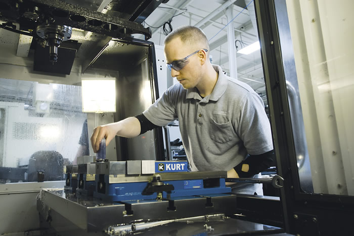 Machinist Joe Wetzel sets up an operation at Protomatic. Image courtesy Protomatic. Machinist Joe Wetzel sets up an operation at Protomatic. Image courtesy Protomatic.
