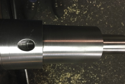 The angled hole on this shaft required a delicate touch while being drilled on a knee mill. Image courtesy Washington Machine Works. The angled hole on this shaft required a delicate touch while being drilled on a knee mill. Image courtesy Washington Machine Works.