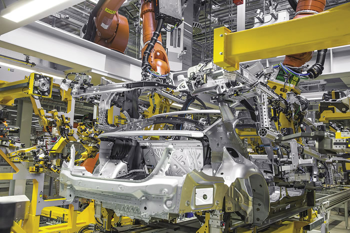 Assembly at BMW's plant in Dingolfing, Germany. BMW has worked with NCMS to research the replacement of parts made of traditional metals with ones made of lightweight titanium alloys or carbon composites. Image courtesy BMW Group. Assembly at BMW's plant in Dingolfing, Germany. BMW has worked with NCMS to research the replacement of parts made of traditional metals with ones made of lightweight titanium alloys or carbon composites. Image courtesy BMW Group.