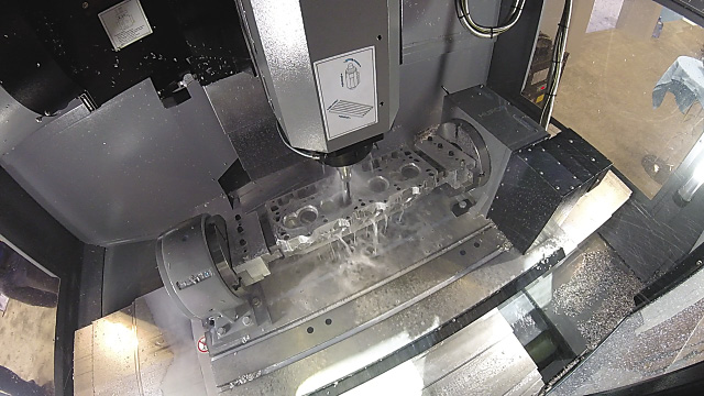 A Mast Motorsports' part is cut on a Hurco 5-axis CNC milling machine. A Mast Motorsports' part is cut on a Hurco 5-axis CNC milling machine.