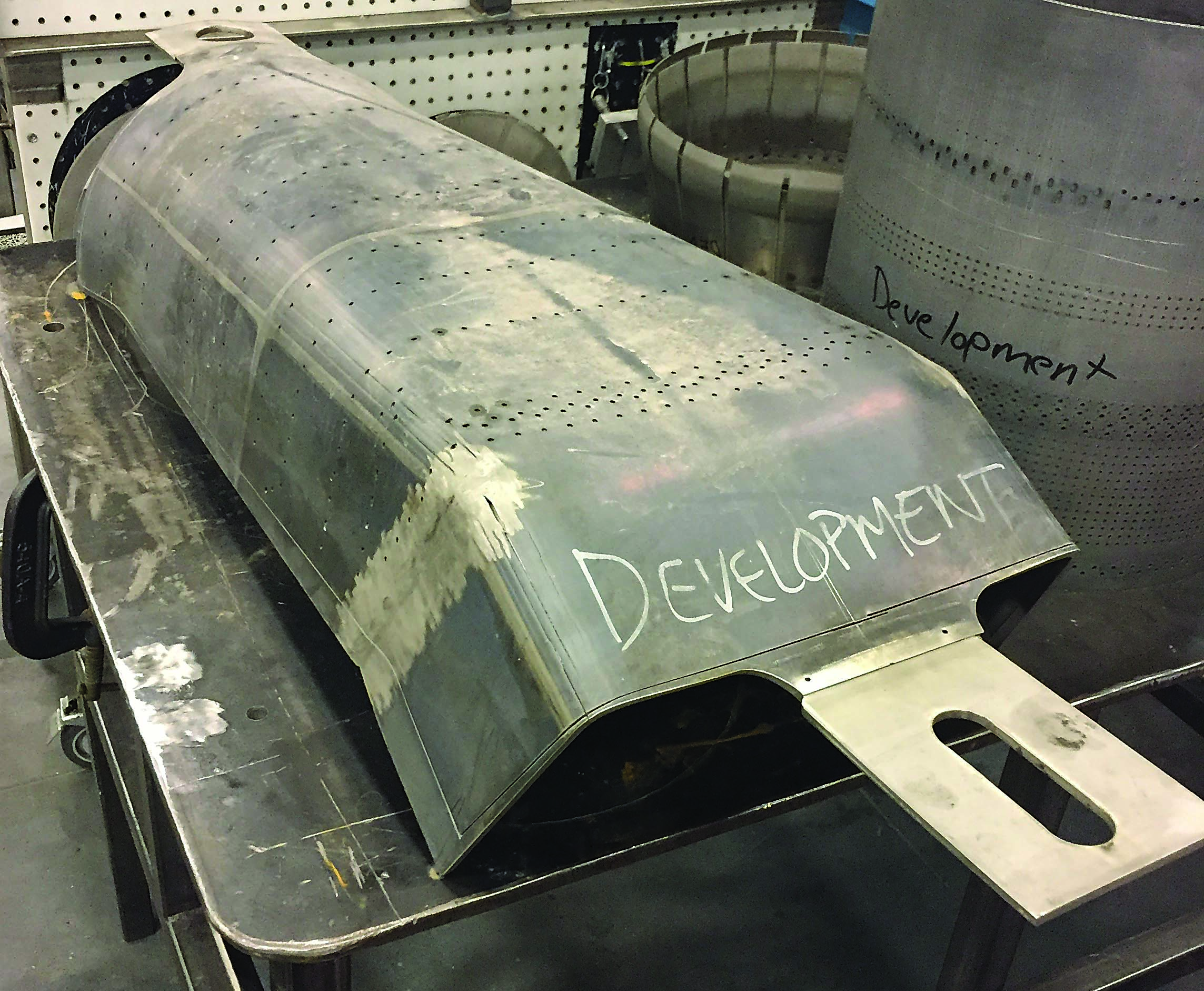 Pictured is the lower half of a gas turbine combustion component. Photo credit: Christopher Tate