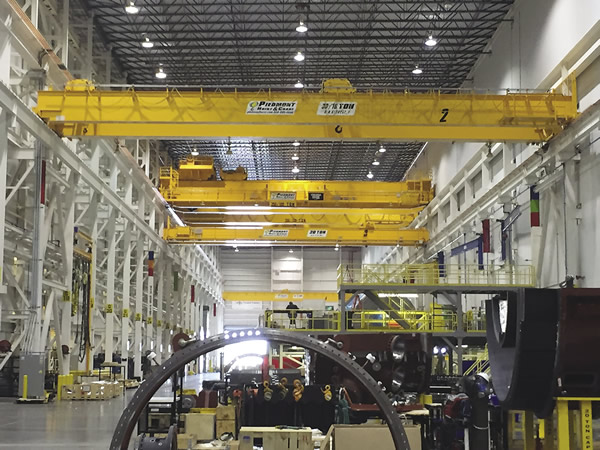 The gas turbine assembly bay is home to the shop's largest bridge cranes. The largest two are rated at 250 tons each. The gas turbine assembly bay is home to the shop's largest bridge cranes. The largest two are rated at 250 tons each.