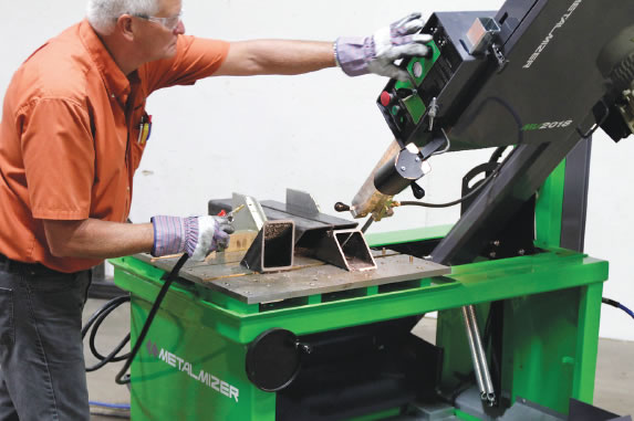 A user checks the angle controls on a MetalMizer vertical bandsaw. Image courtesy Wood-Mizer. A user checks the angle controls on a MetalMizer vertical bandsaw. Image courtesy Wood-Mizer.