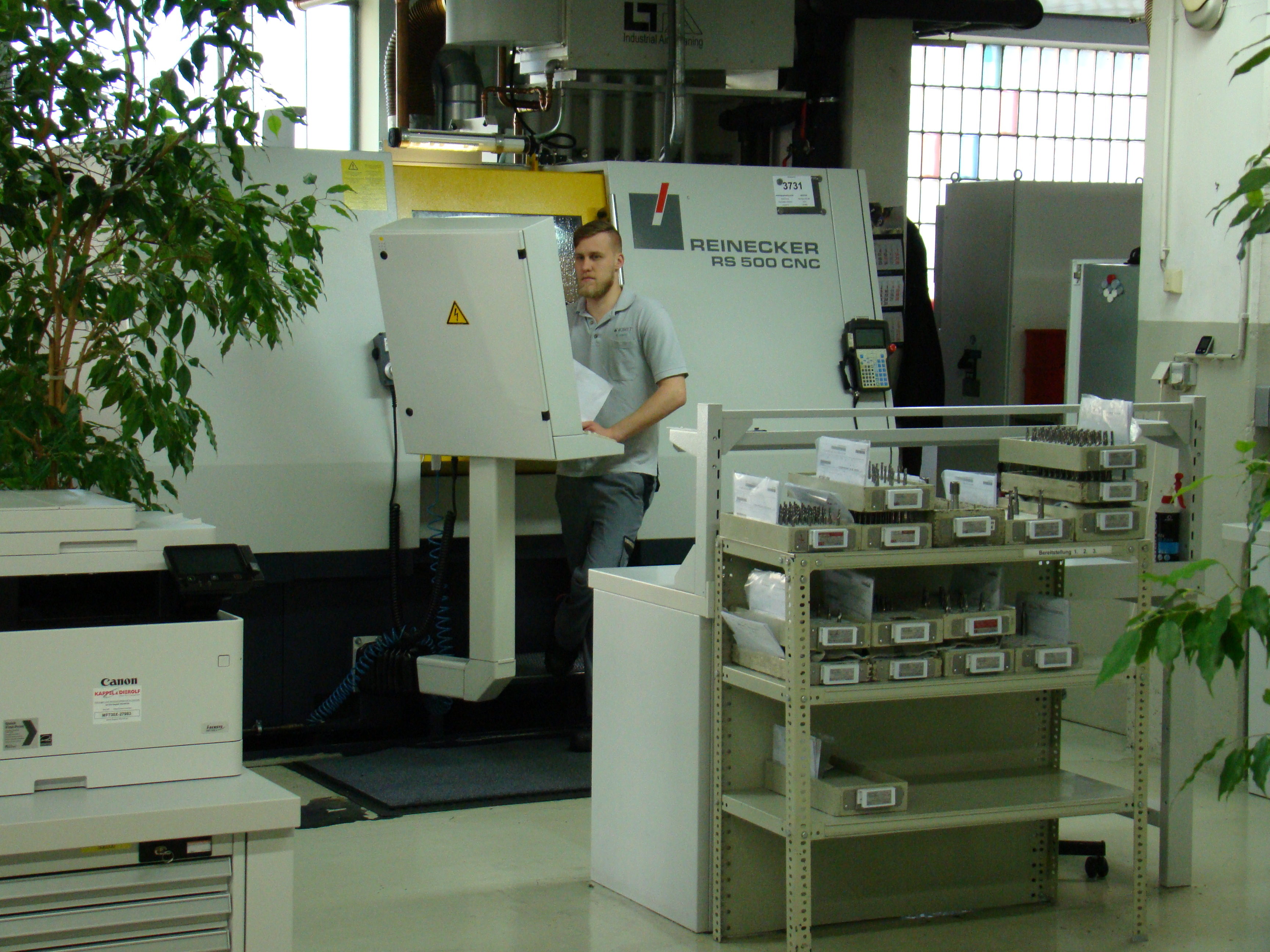 A machinist runs a Reinecker RS 500 CNC grinding machine at Komet Deutschland. Photo by Alan Richter