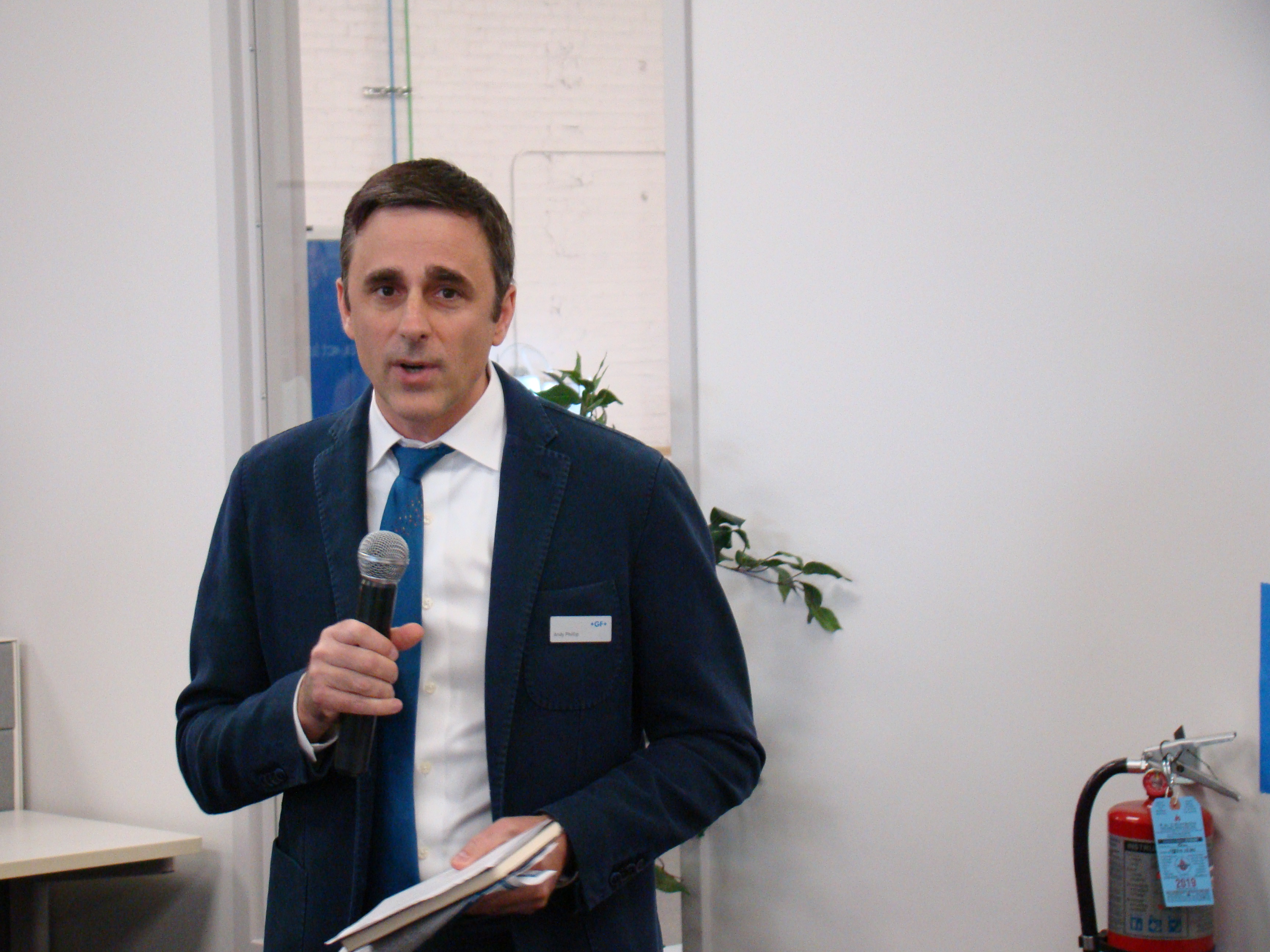 Andy Phillip presents the welcoming remarks and intro to Microlution at GF Solutions Days. Photo credit: Alan Richter