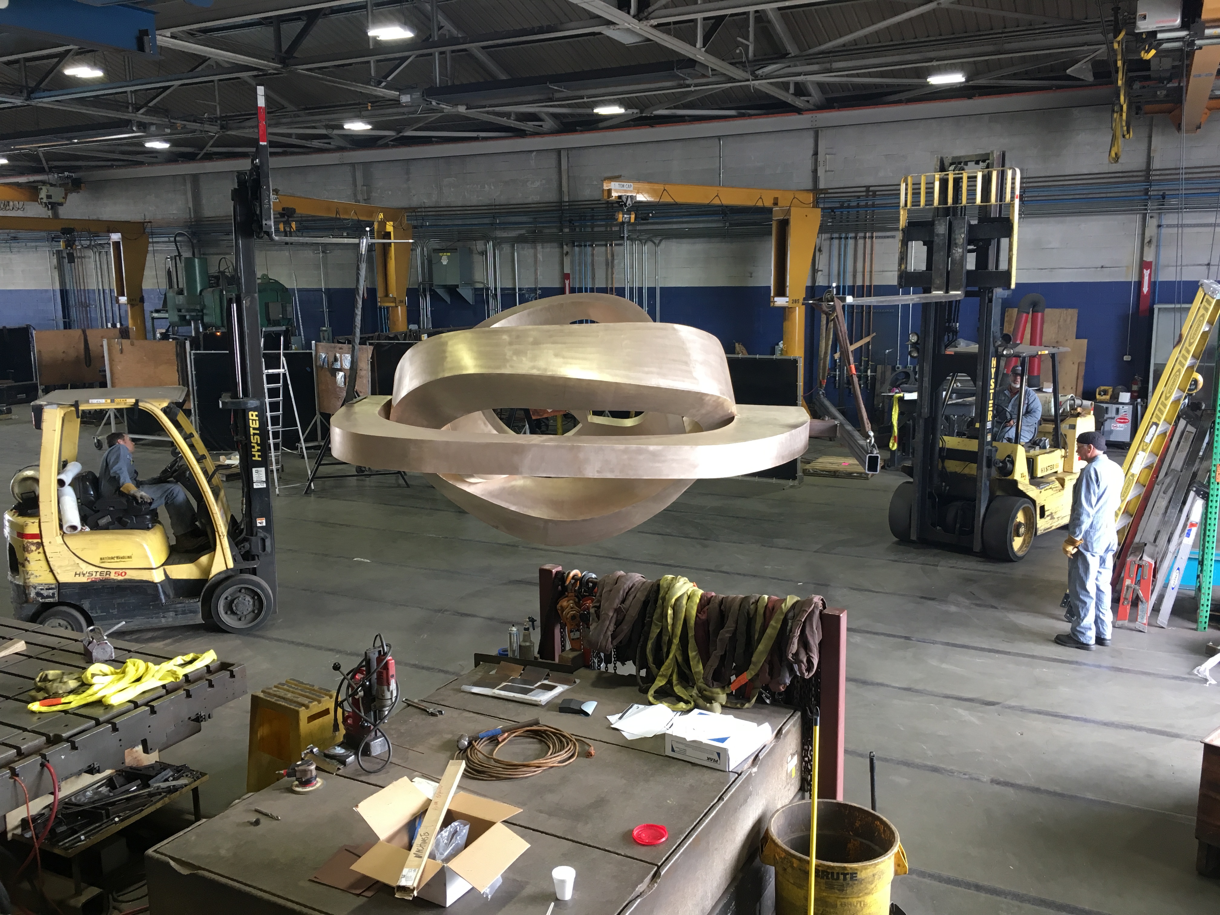 Workers at Machinists move a 14'-tall bronze sculpture conceptualized by local artist Julie Speidel before its installation in downtown Seattle last year. Photo courtesy of Machinists.