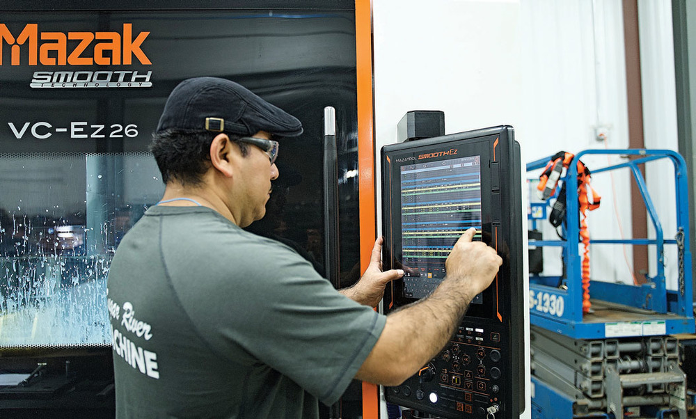 Image of Lucas Goza with Sugar River Machine
