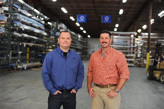 Thomas DeSaulniers (left), branch manager of T&C Metals, with United States Coast Guard veteran Justin Wood at T&C's Jacksonville warehouse. 