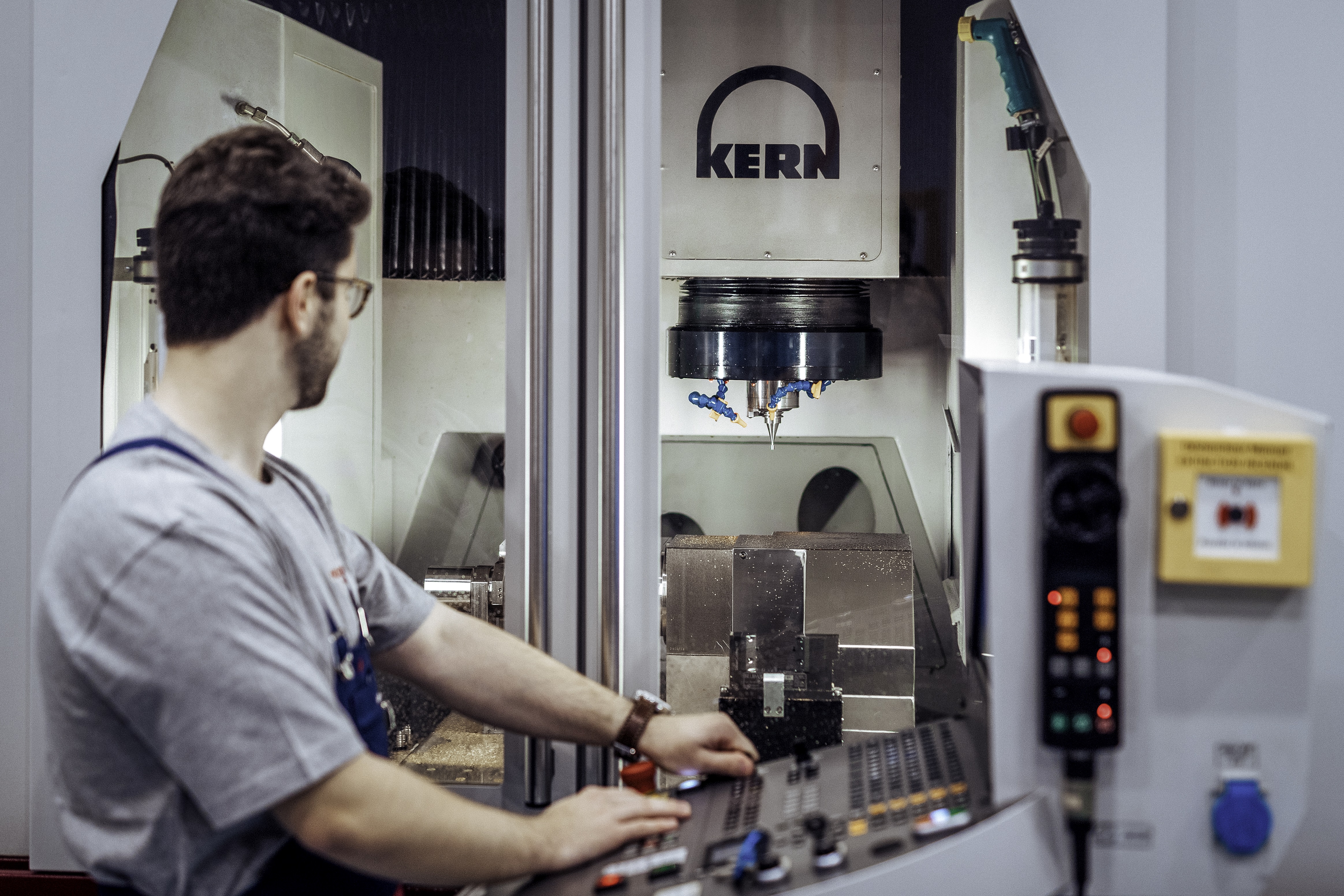 Watchmaker manufactures small parts with a high-precision machine tool image