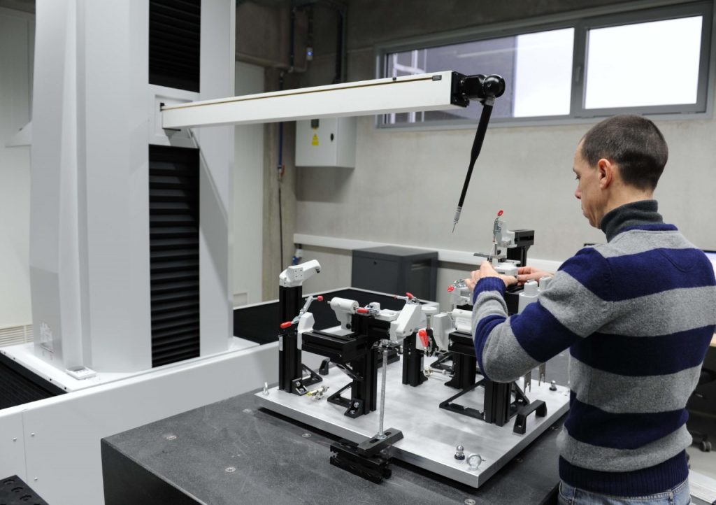 Fig. 1 A modular fixture with additively manufactured locators being inspected on the LK CMM