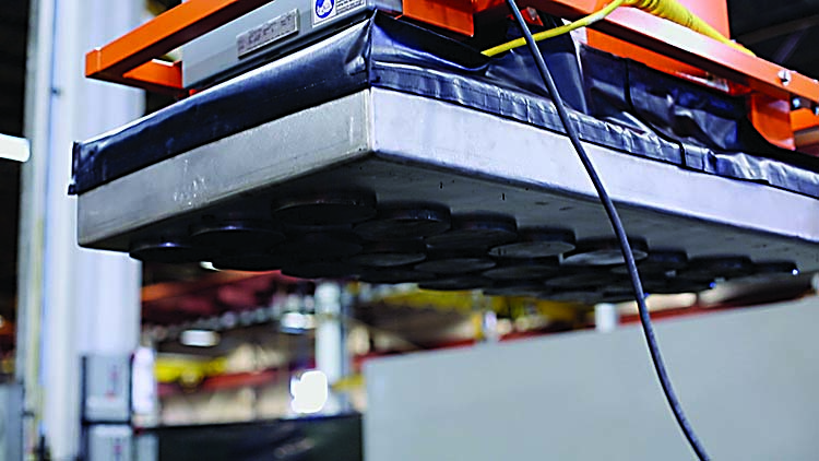 Eriez Manufacturing's air-operated Burn Table Full-Coverage Lift Magnet System.