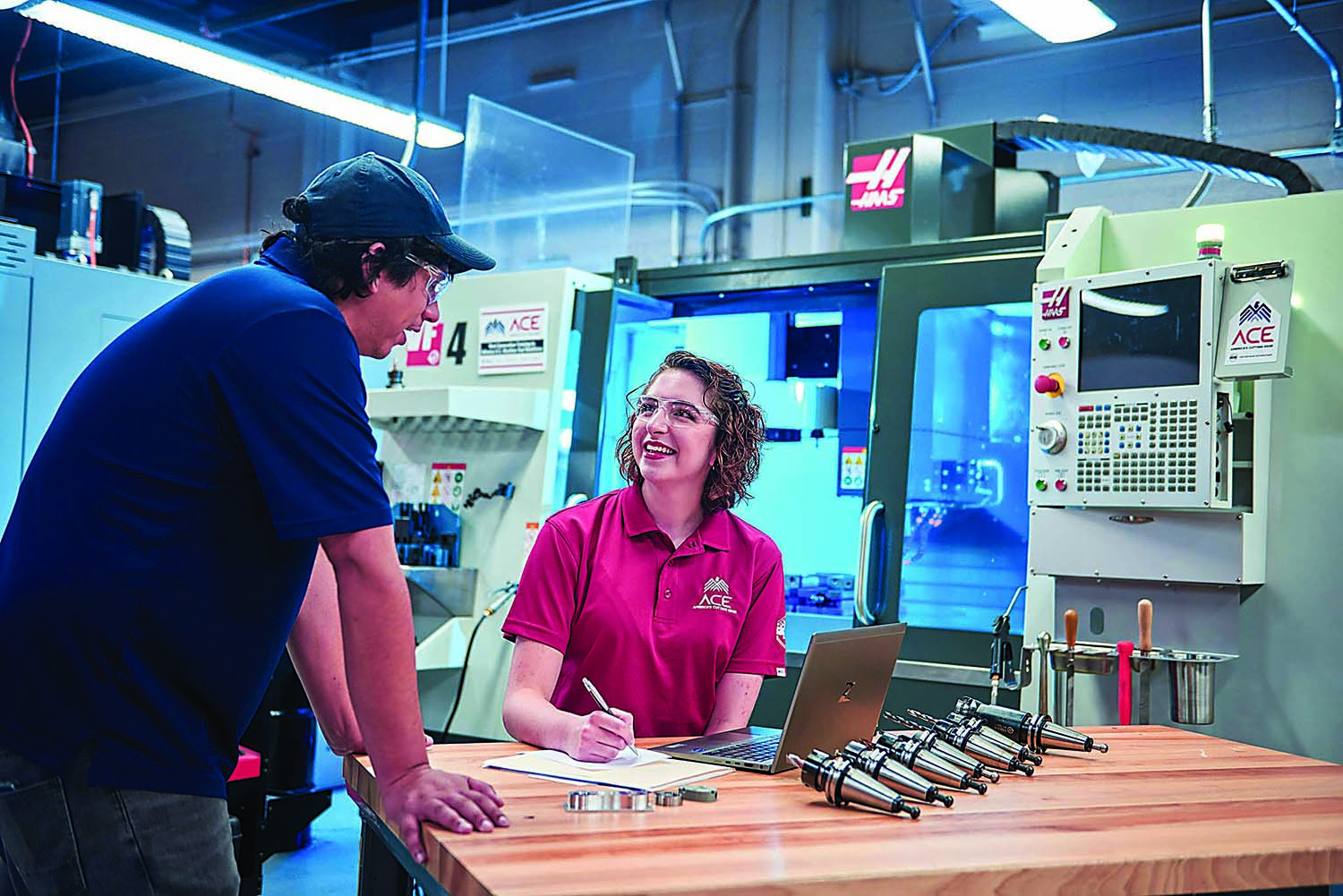 An ACE instructor (left) works with a participant at an in-person training session. 