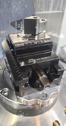 Figure 1: United Machine first tested the Mate DynoGrip vise to make an aircraft galley cabinet latch from stainless steel.